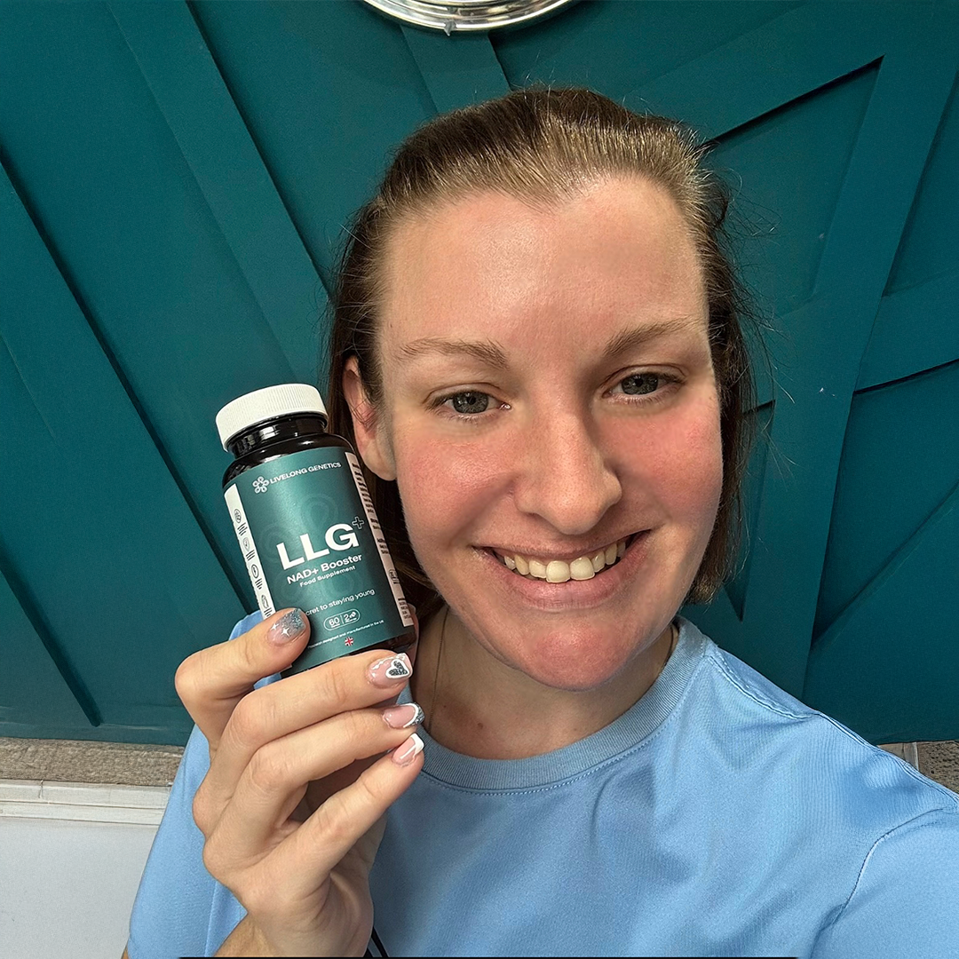 a-happy-woman-in-her-30-holding-a-bottle-of-LLG-NAD-Booster